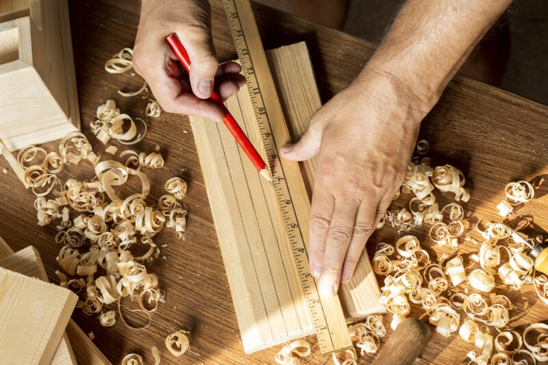 carpenter-measuring-with-ruler-pencil